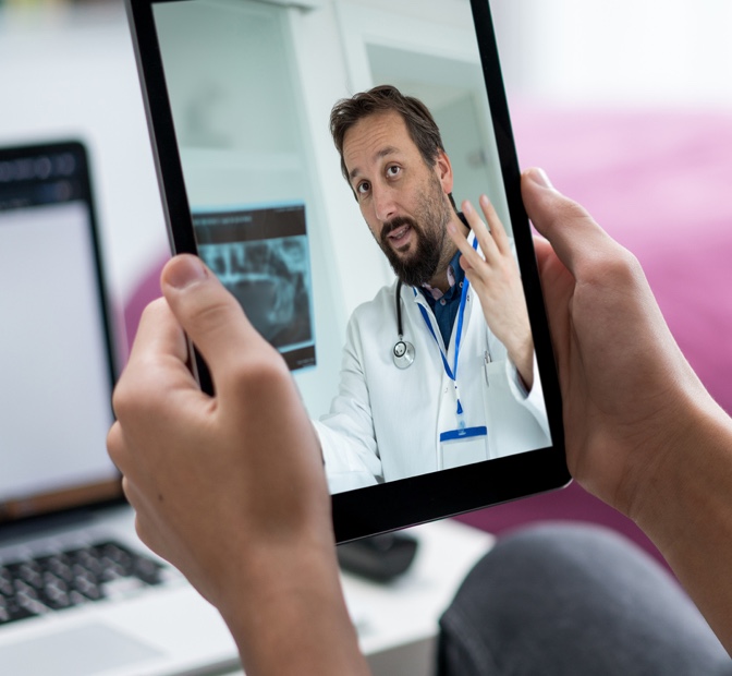 Virtual dermatologist appointment on a tablet